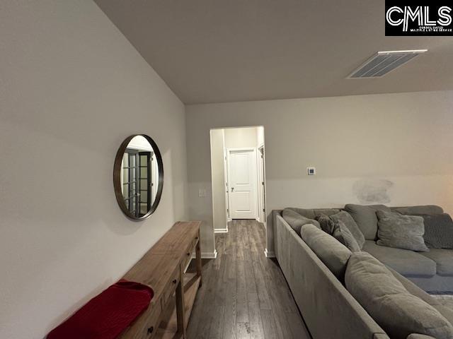 living room with dark wood-type flooring