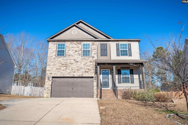 view of front of house featuring covered porch and a garage