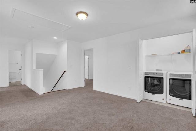 laundry area with washer and clothes dryer and carpet floors