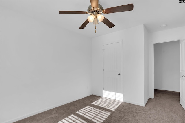 unfurnished bedroom featuring light carpet, a closet, and ceiling fan