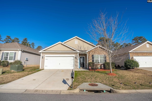 single story home featuring a front lawn and a garage