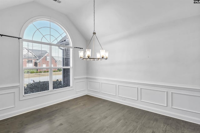 unfurnished dining area with dark hardwood / wood-style flooring, a chandelier, and vaulted ceiling