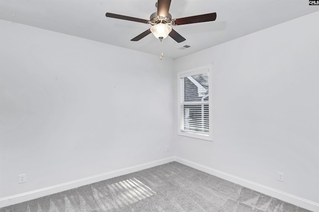 empty room with carpet flooring and ceiling fan