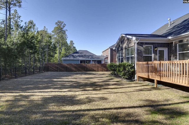 view of yard with a wooden deck