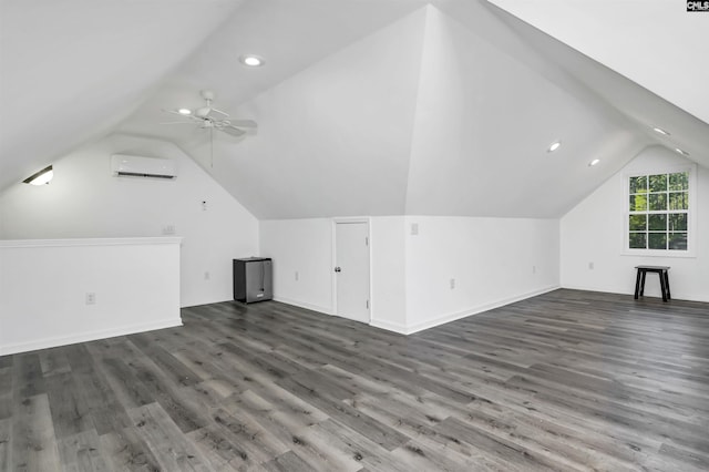 bonus room featuring ceiling fan, dark hardwood / wood-style floors, an AC wall unit, and vaulted ceiling