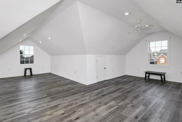 bonus room with dark hardwood / wood-style floors, vaulted ceiling, and ceiling fan