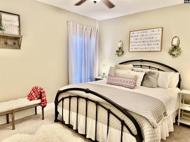 bedroom featuring ceiling fan and light carpet