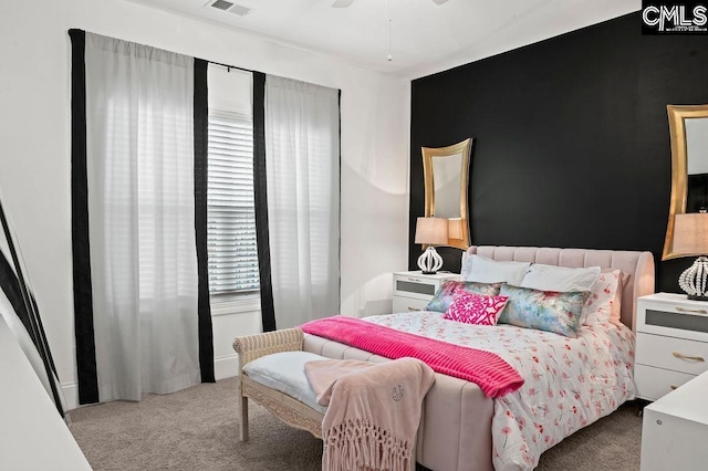 carpeted bedroom with ceiling fan