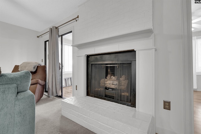 room details with carpet and a brick fireplace