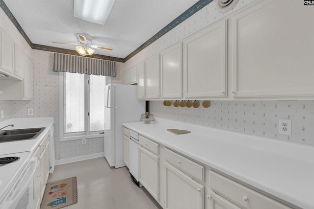 kitchen featuring white cabinetry, sink, ceiling fan, a textured ceiling, and white appliances