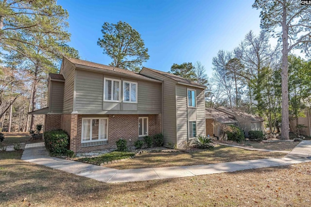 front facade with a front lawn