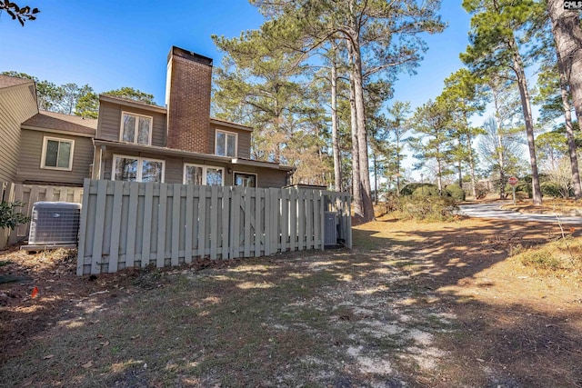 back of property featuring cooling unit