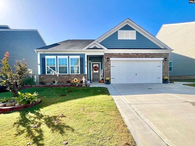 craftsman-style house featuring a garage and a front lawn