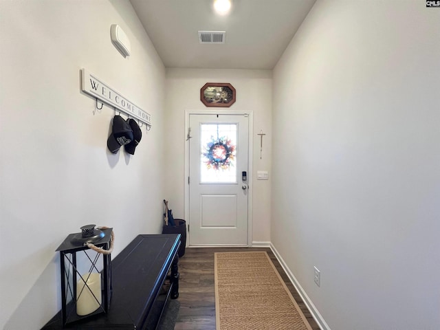 entryway with dark hardwood / wood-style flooring