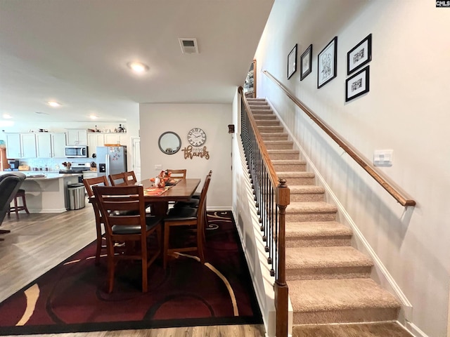 dining room with hardwood / wood-style floors