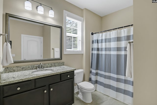 bathroom with a shower with curtain, vanity, and toilet