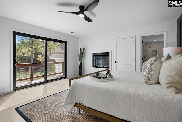 bedroom with ceiling fan and access to outside