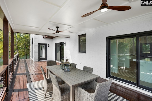 wooden terrace featuring ceiling fan