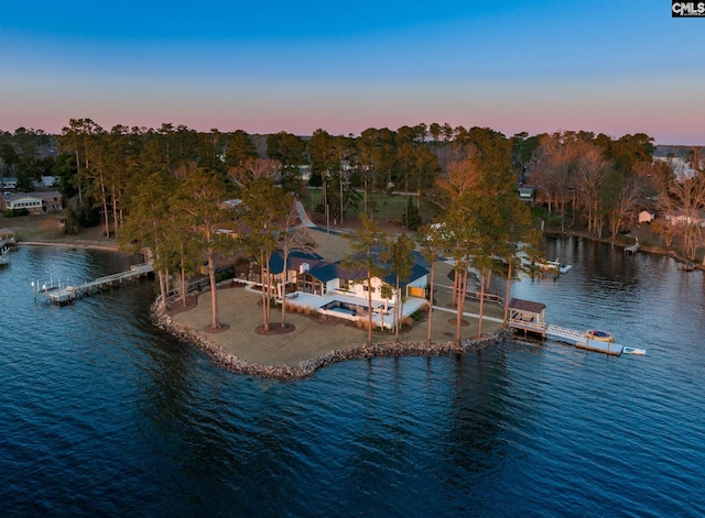 aerial view at dusk with a water view