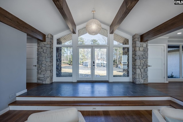 interior space with french doors, vaulted ceiling with beams, dark hardwood / wood-style floors, and an inviting chandelier