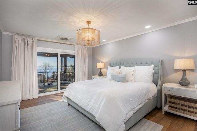 bedroom with ornamental molding, dark wood-type flooring, access to outside, and a chandelier