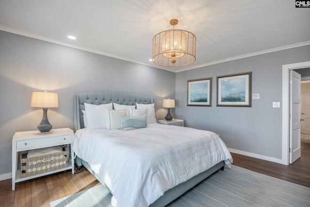 bedroom with crown molding and wood-type flooring