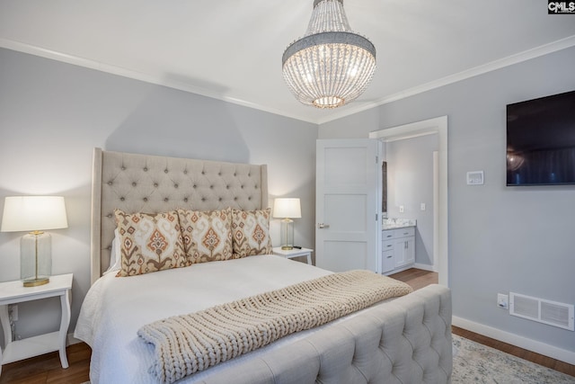 bedroom with a chandelier, light hardwood / wood-style floors, ensuite bath, and ornamental molding