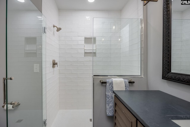 bathroom with vanity and walk in shower