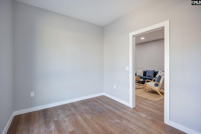 spare room with light hardwood / wood-style flooring