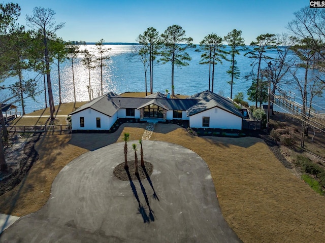 view of front of house with a water view