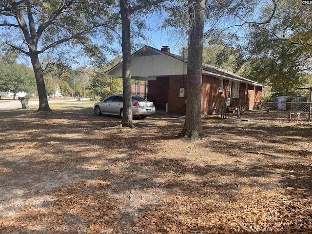 view of home's exterior with a carport