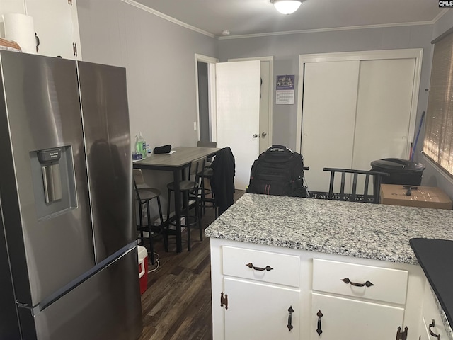 kitchen featuring white cabinets, stainless steel fridge with ice dispenser, light stone countertops, and crown molding