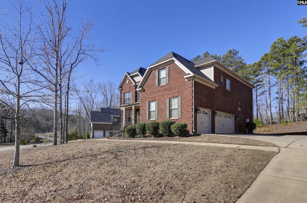 view of side of home with a garage