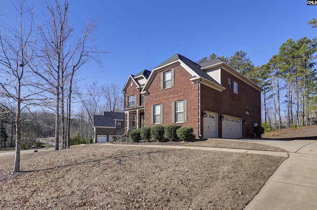 view of side of home with a garage