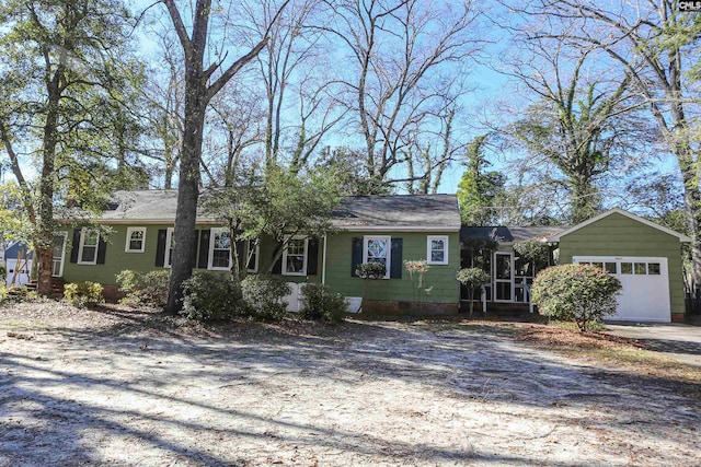 single story home featuring a garage