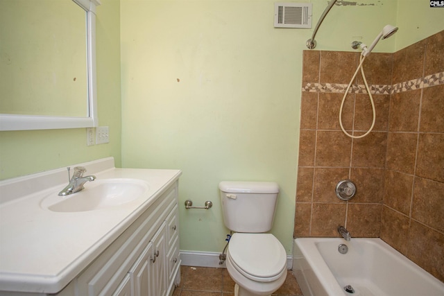 full bathroom with vanity, tiled shower / bath combo, toilet, and tile patterned flooring