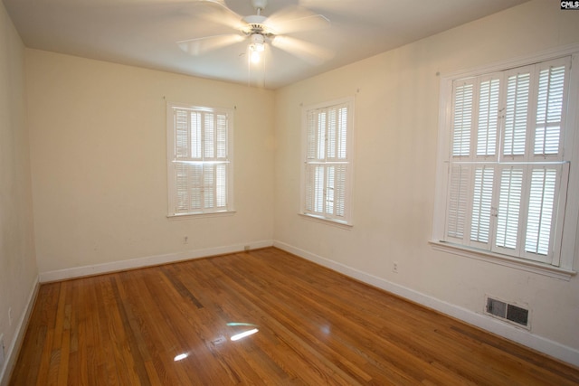 spare room featuring ceiling fan and hardwood / wood-style floors