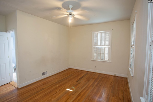 unfurnished room with wood-type flooring and ceiling fan