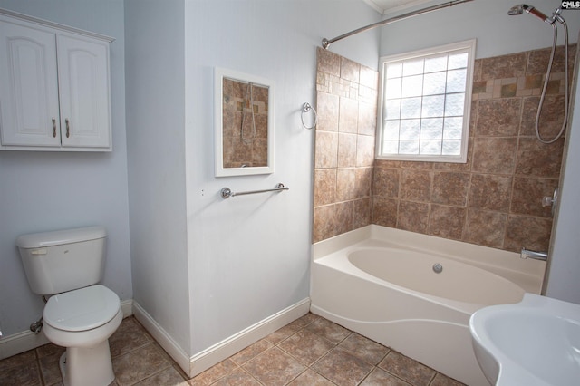 bathroom with tile patterned flooring, toilet, and tub / shower combination