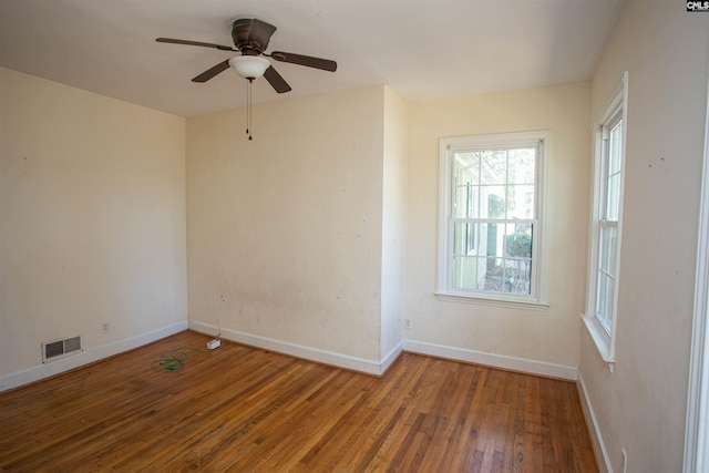 empty room featuring wood-type flooring and ceiling fan