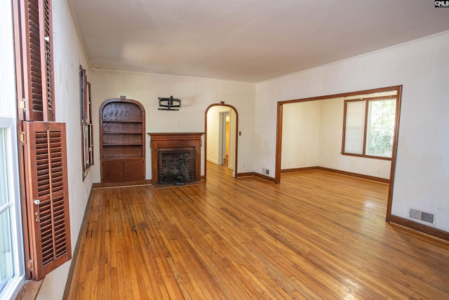 unfurnished living room featuring hardwood / wood-style floors