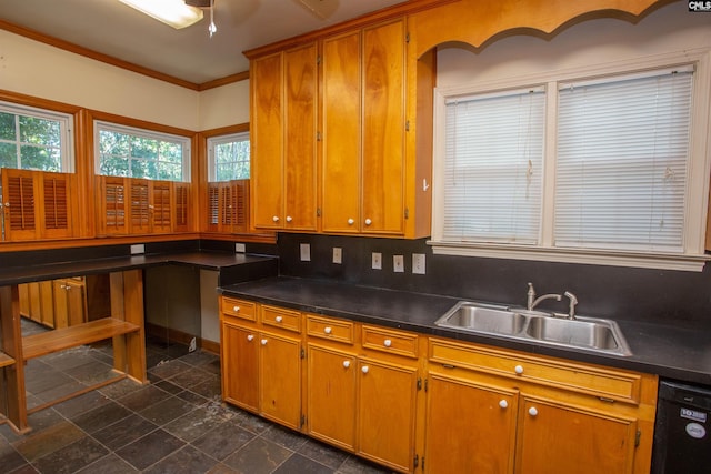 kitchen featuring decorative backsplash, sink, crown molding, and black dishwasher