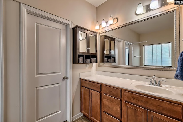 bathroom featuring tile patterned flooring and vanity