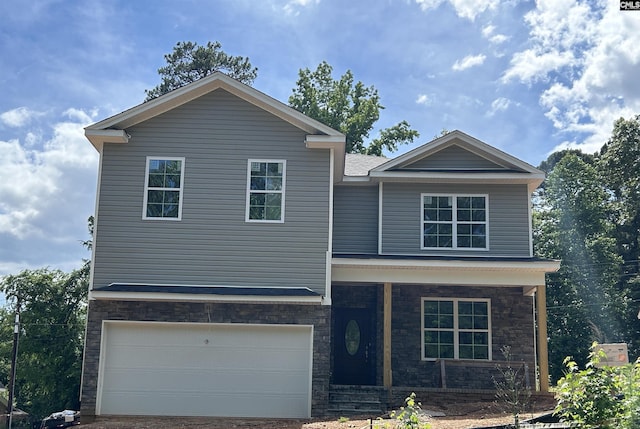 view of front facade with a porch and a garage