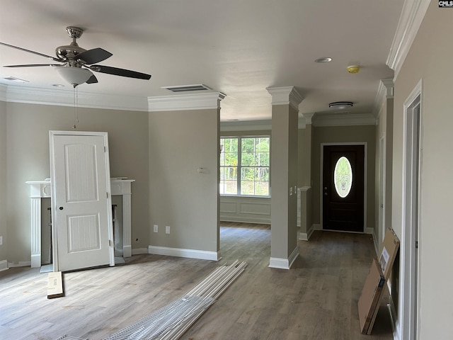 foyer featuring crown molding, ceiling fan, and hardwood / wood-style flooring