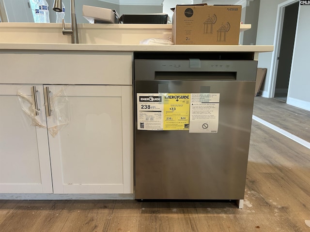 interior details featuring white cabinetry and dishwasher