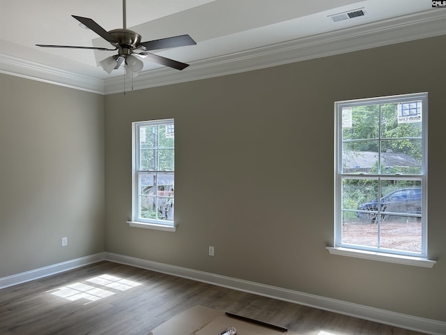 unfurnished room with hardwood / wood-style flooring, ceiling fan, and ornamental molding