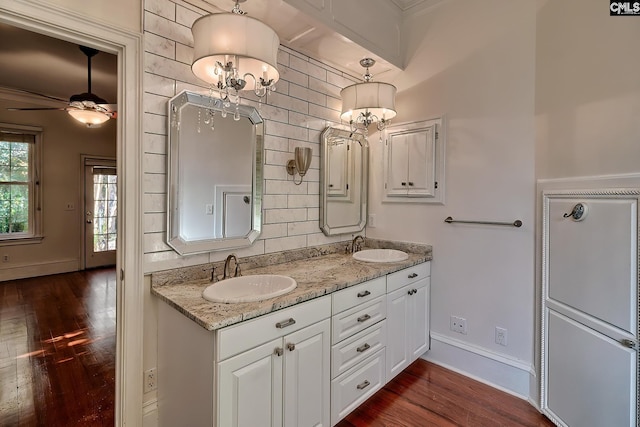 bathroom with hardwood / wood-style floors, vanity, and ceiling fan