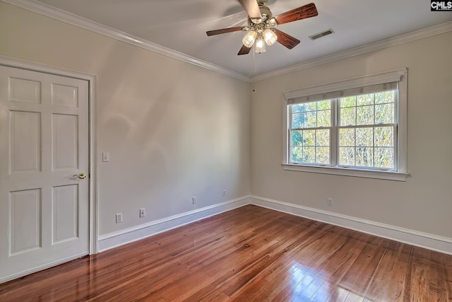 empty room featuring hardwood / wood-style floors, ceiling fan, and crown molding