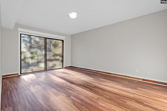 unfurnished room with light hardwood / wood-style floors